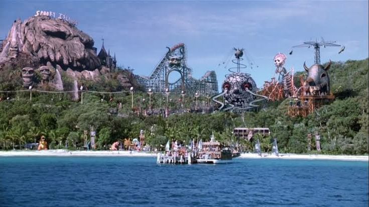 an amusement park in the middle of some water