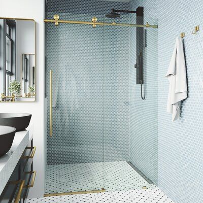 a bathroom with a shower, sink and mirror