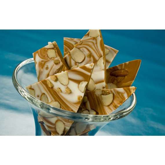 a glass bowl filled with pieces of chocolate