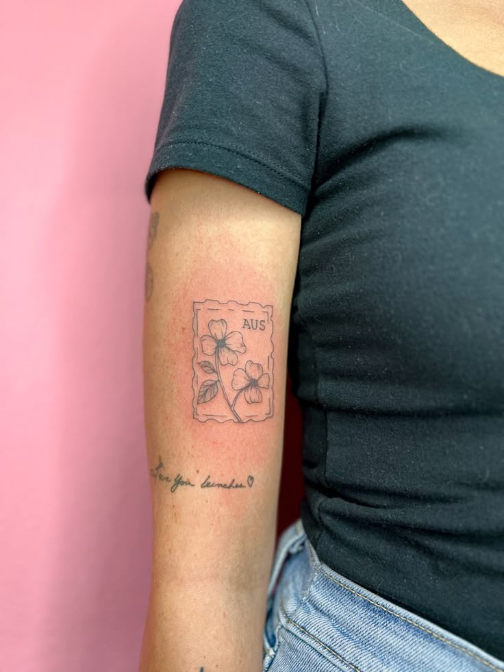 a woman with a small tattoo on her arm