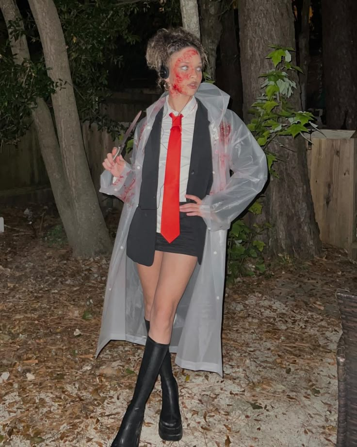 a woman dressed up as a vampire in the woods