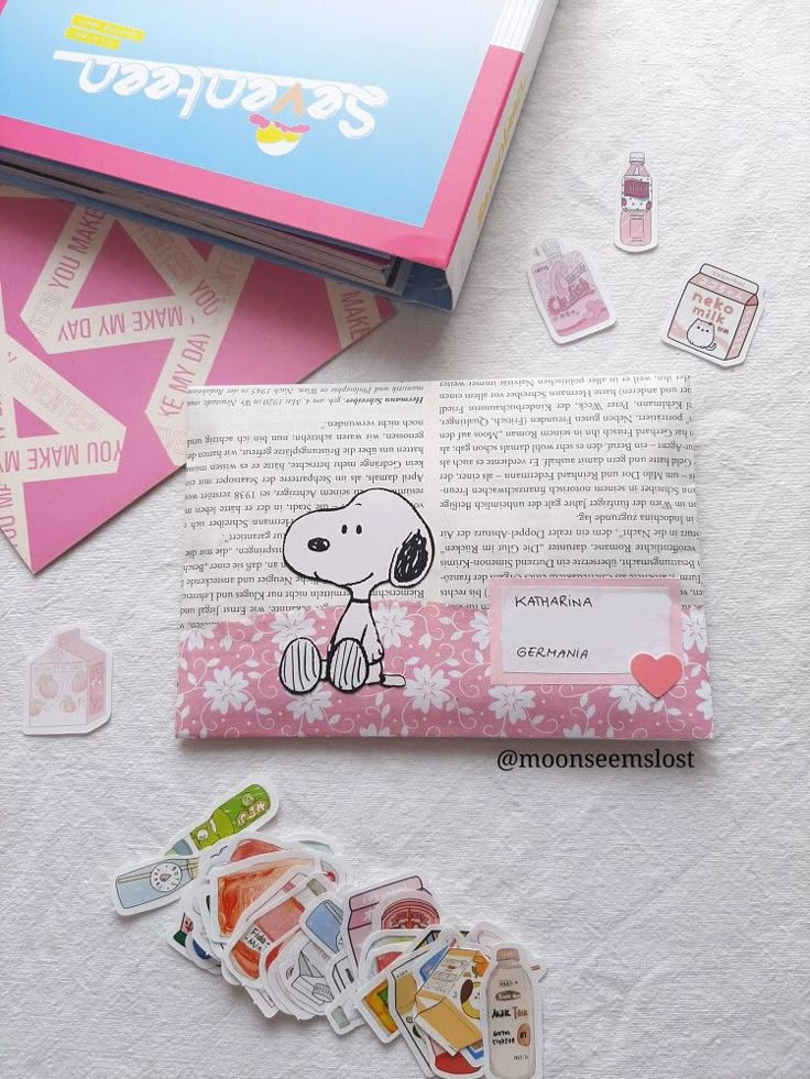 some stickers are laying on top of a book and other things to do with them