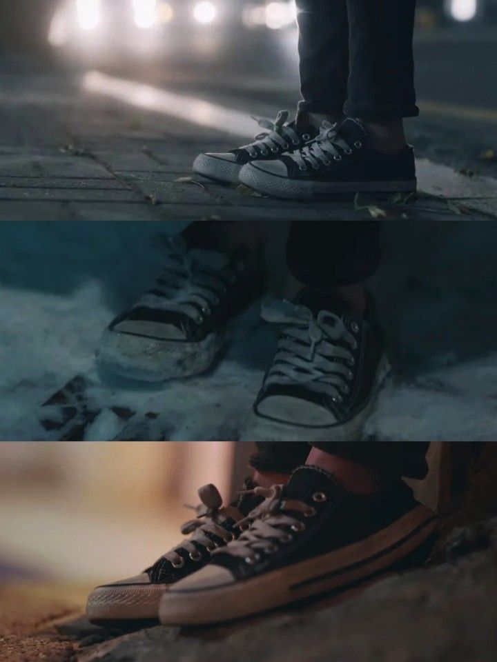 two different shots of someone's shoes on the street at night and in the dark