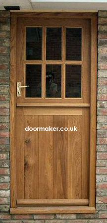 a wooden door on the side of a brick building