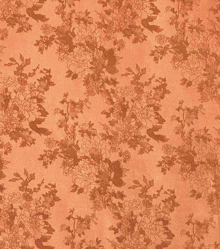 an orange floral wallpaper with birds and flowers on the back ground, in front of a brown background