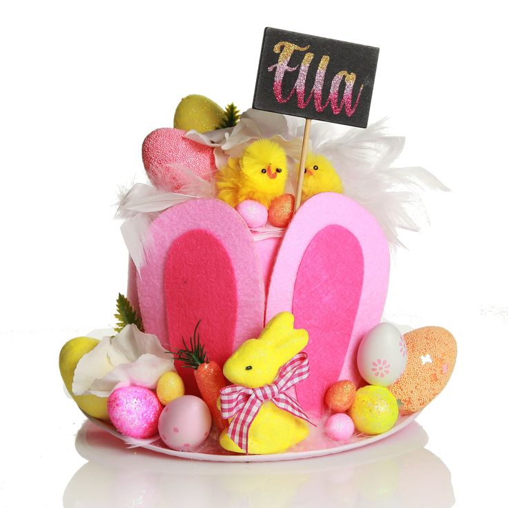 an easter basket filled with peepies, eggs and candy