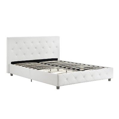 a white bed frame with buttons on the headboard and foot board is shown in front of a white background