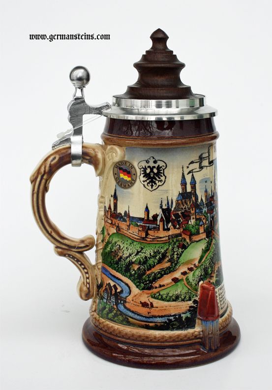 a beer mug with a handle that has a painting on it