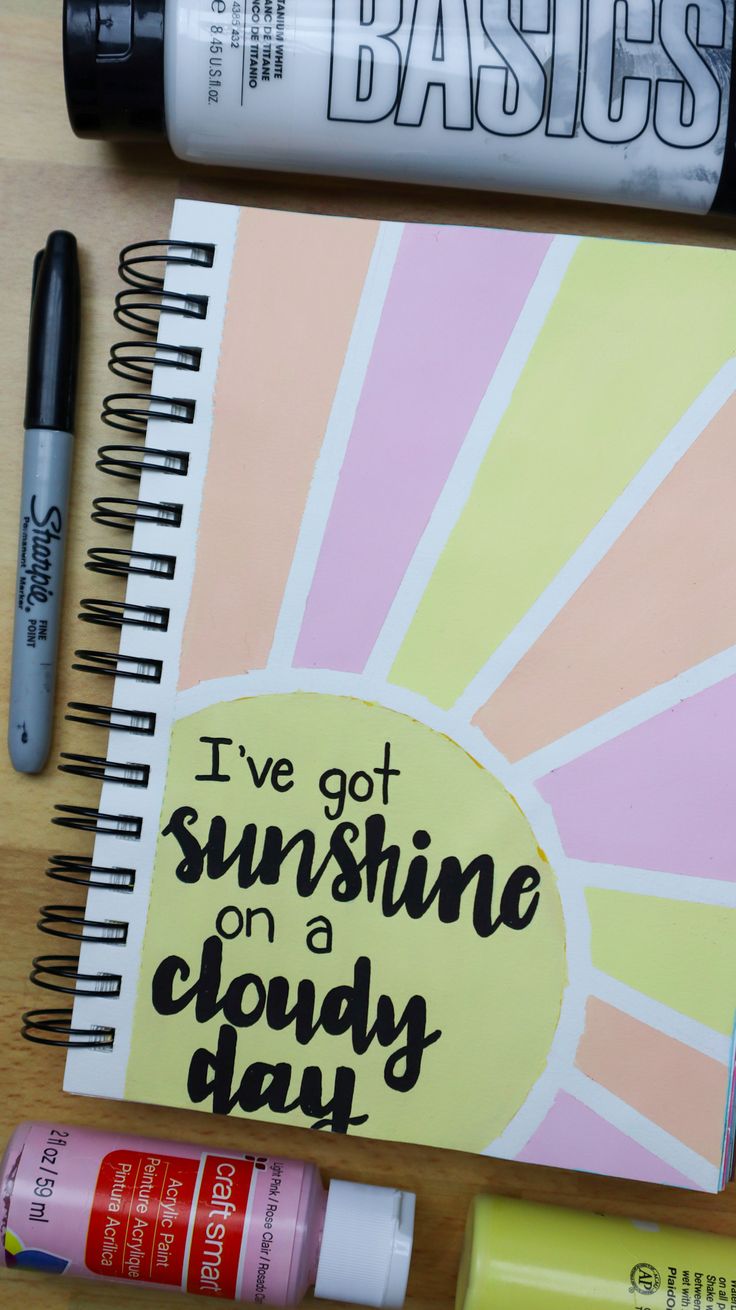 a spiral notebook with the words i've got sunshine on a cloudy day written in black ink