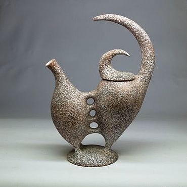 a ceramic teapot shaped like an elephant