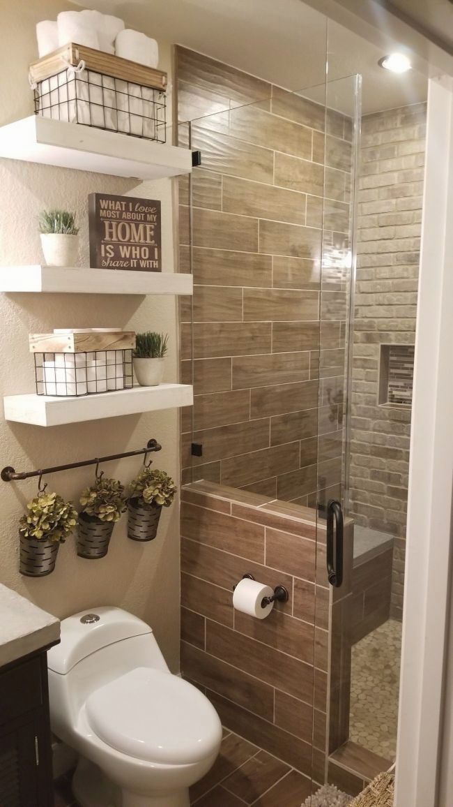 a bathroom with a toilet, shower and shelves