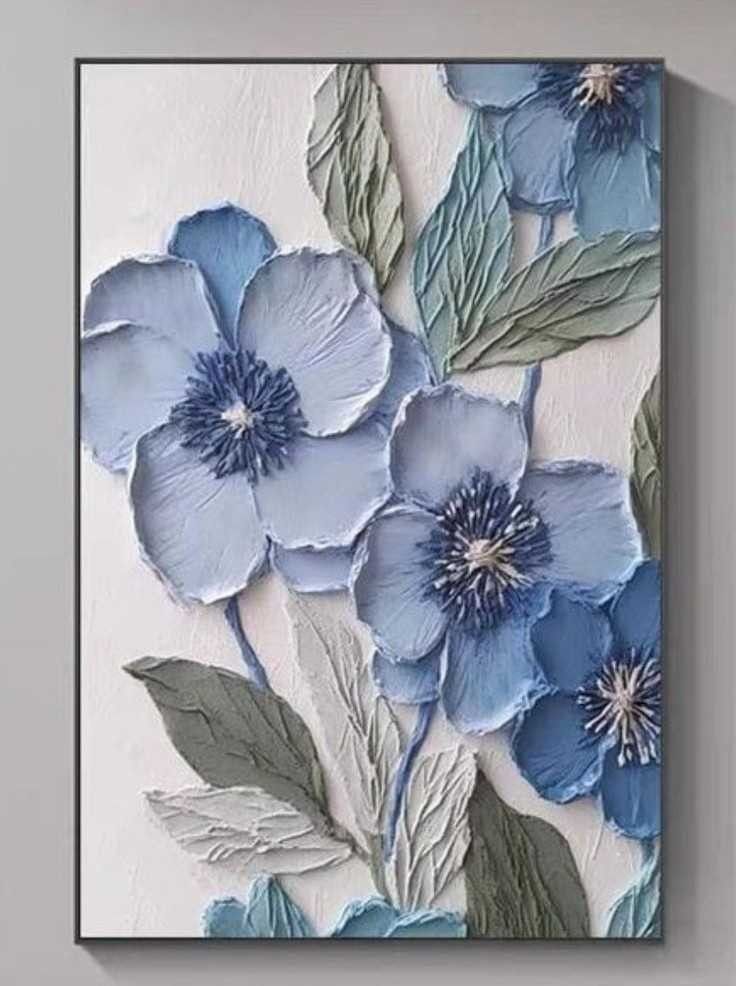 blue flowers are painted on a white wall