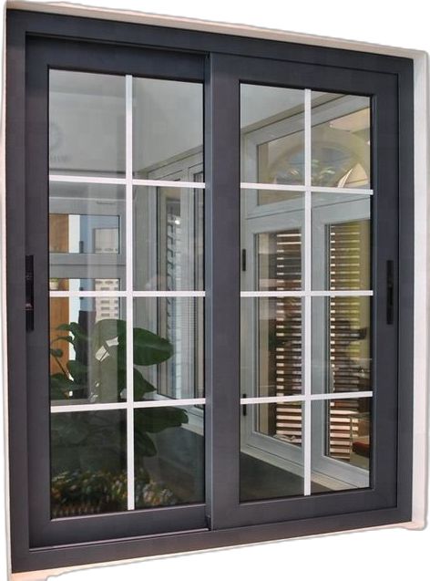 an open window with shutters and blinds on the side of a building in front of a potted plant