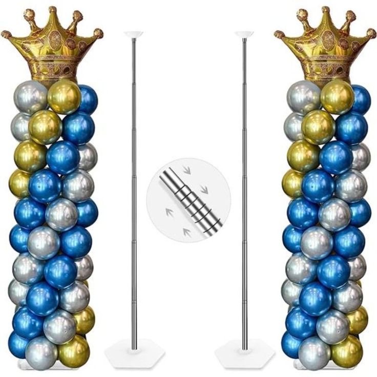 two tall blue and gold balloons with a crown on top, standing next to each other