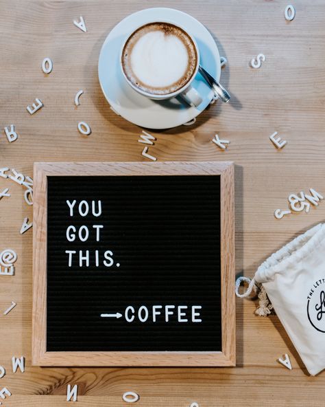 a sign that says you got this coffee next to a cup of coffee