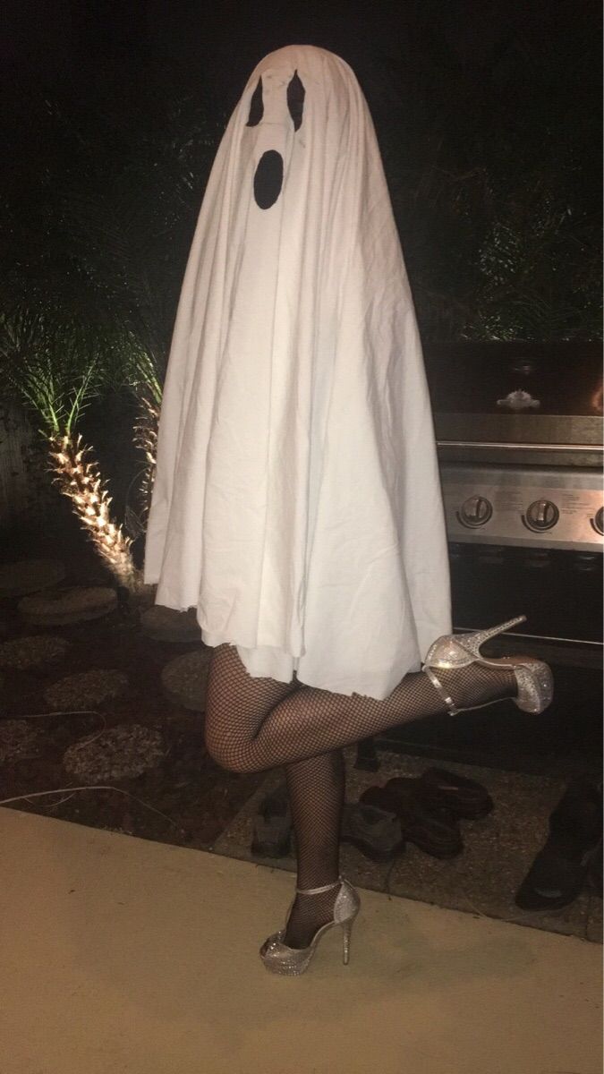 a woman dressed in a ghost costume