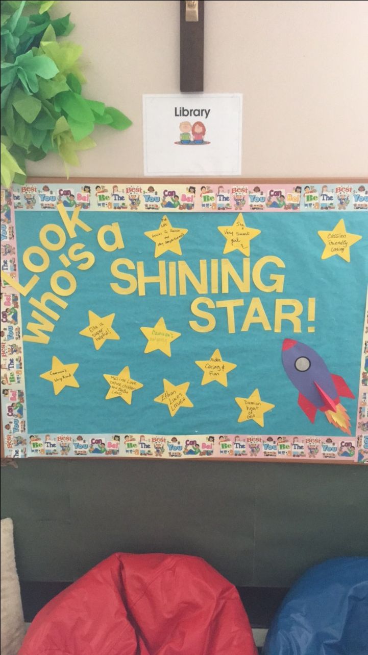 a bulletin board that says look who's shinning star and two bean bag chairs