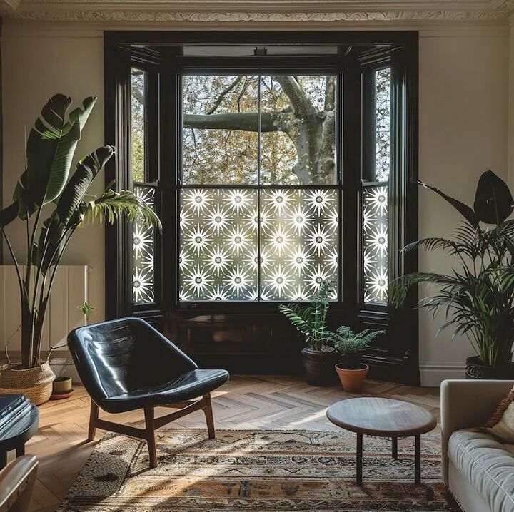 a living room filled with furniture and windows covered in frosted glass covering the window