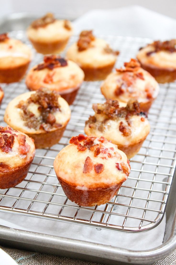 there are many muffins on the cooling rack