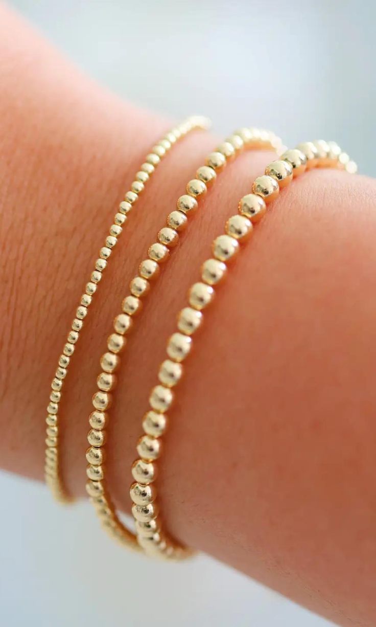 This simple beaded bracelet is perfect for adding a dainty accessory to your wrist. These bracelets come in different sized gold beads. Wear it alone or stack it for the perfect arm party. Stretch fit 18K Gold filled Hypoallergenic Sweat proof Tarnish resistant Dainty and hollow beads 6.5" Made in USA Style Code: BK-STG-THR Gold Beaded Bracelet With Tiny 14k Gold Filled Beads, Gold 14k Gold-filled Tiny Beaded Bracelets, Yellow Gold Beaded Bracelets With Tiny Round Beads, 14k Gold Filled Tiny Beads Bracelets, 14k Gold-filled Bracelets With Tiny Beads, 14k Gold Filled Tiny Beaded Bracelets, Minimalist Beaded Bracelets With Tiny Beads, Minimalist Tiny Beaded Bracelets, Minimalist Yellow Gold Beaded Bracelets With Spacer Beads