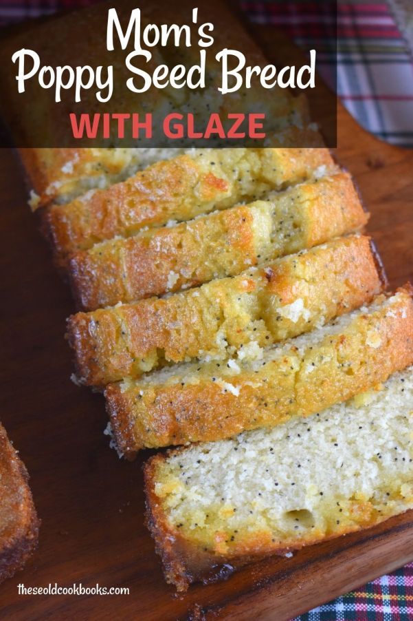 a loaf of poppy seed bread with glaze on a cutting board next to some slices