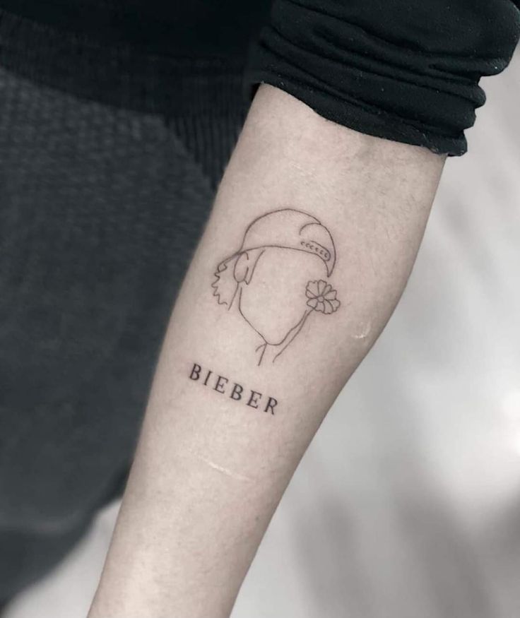 a woman's arm with a tattoo on it that says, bierer