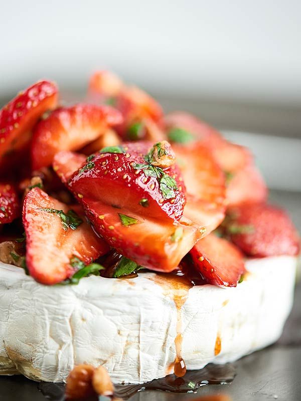 a close up of a piece of bread with strawberries on it