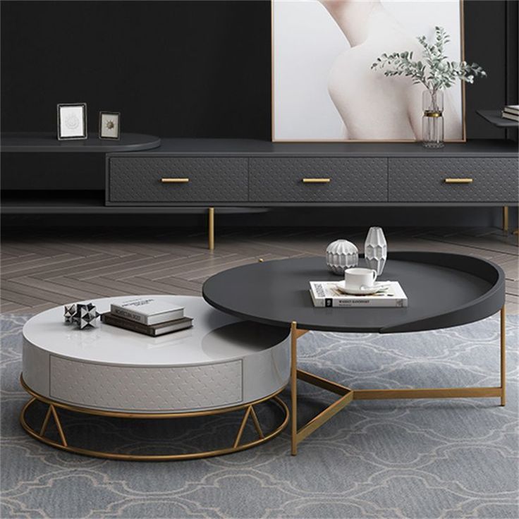 a living room with two round coffee tables