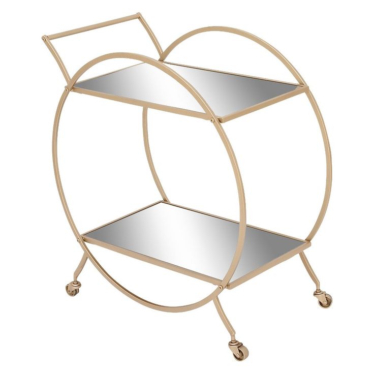 a round metal shelf with two mirrors on it's sides and wheels, against a white background