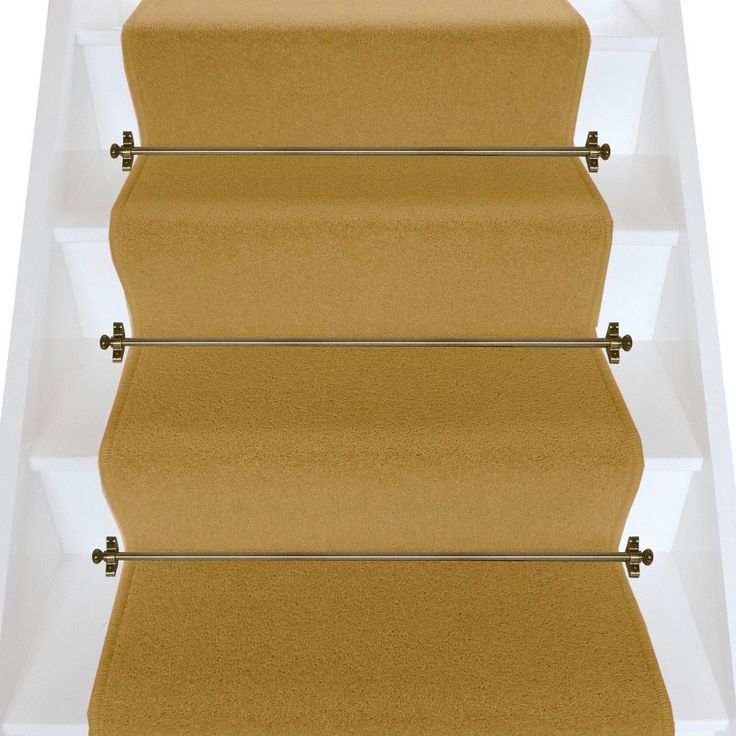 a set of three beige stairs with glass shelves on each side and two metal rails at the bottom