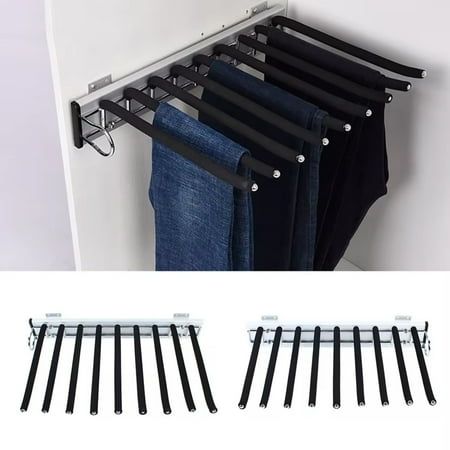 four pairs of jeans hanging on a rail with clips to hang them from the wall