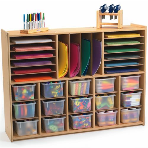 a wooden storage unit filled with lots of different colored plastic bins and trays