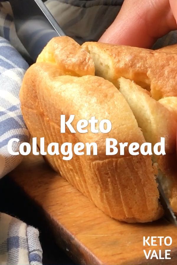 a person cutting into a loaf of bread on top of a wooden board with the words keto collagen bread