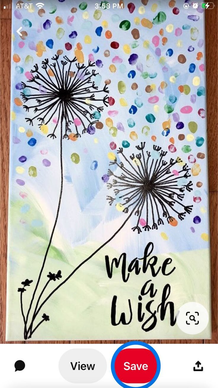 a painting with the words make wish and dandelions on it, next to an iphone