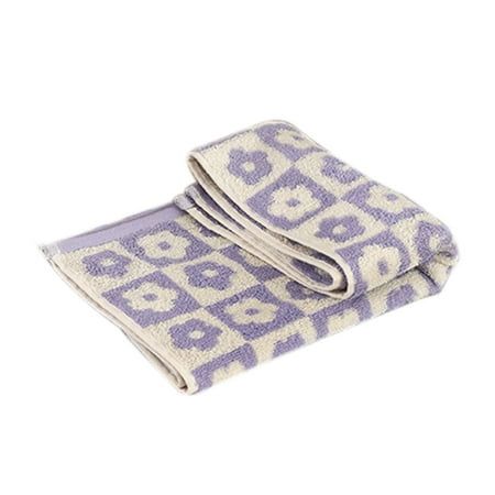 two towels folded on top of each other in front of a white background with blue and purple designs