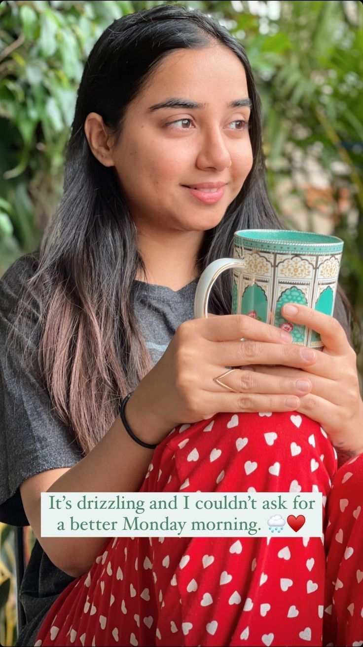 a woman is holding a coffee mug in her hands and smiling at the camera with an interesting message on it