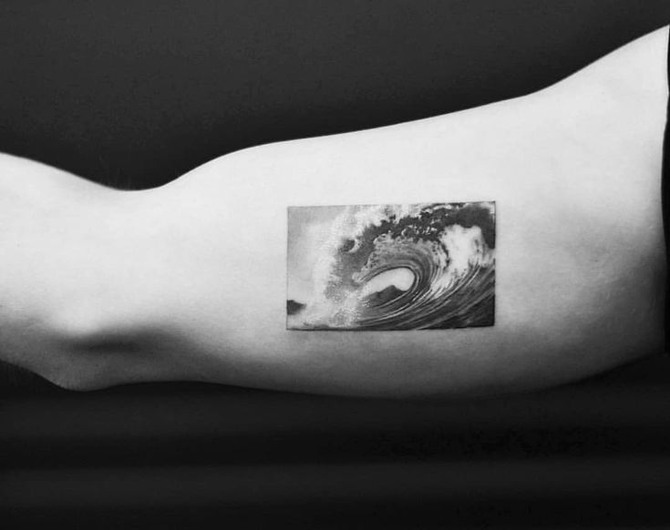 a black and white photo of a wave on the arm