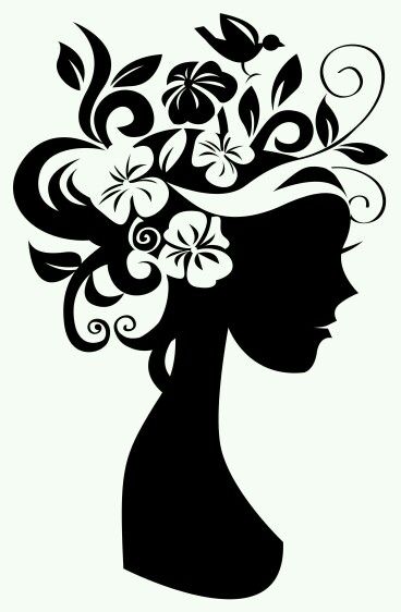 the silhouette of a woman with flowers in her hair