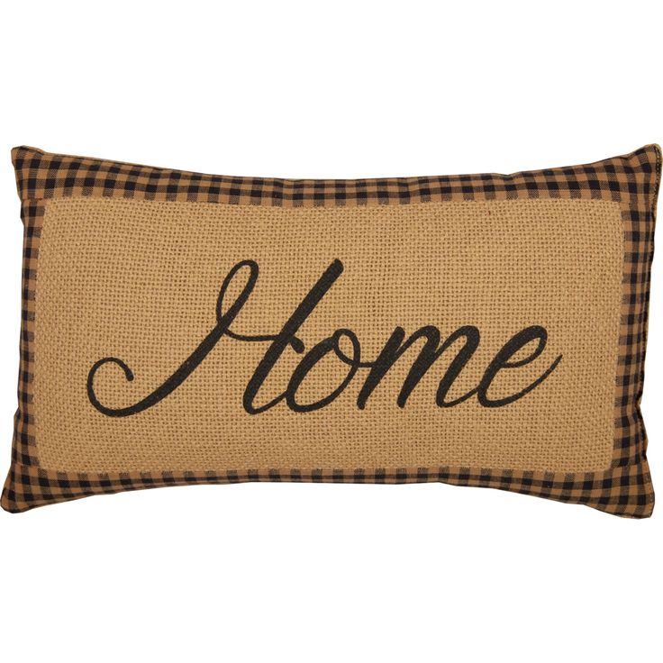 a pillow with the word home on it in black and tan checkered linens