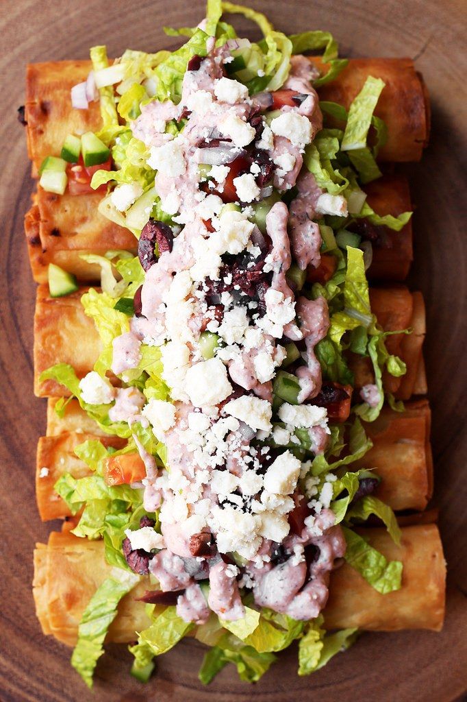 an appetizer with meat, cheese and lettuce is on a plate