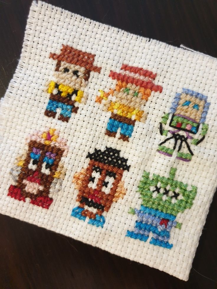 the cross stitch pattern has four different characters on it