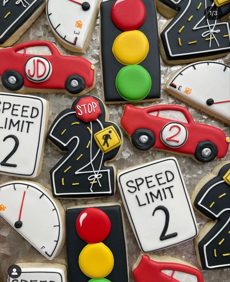 decorated cookies with traffic signs, speed limit and stop lights on top of each other