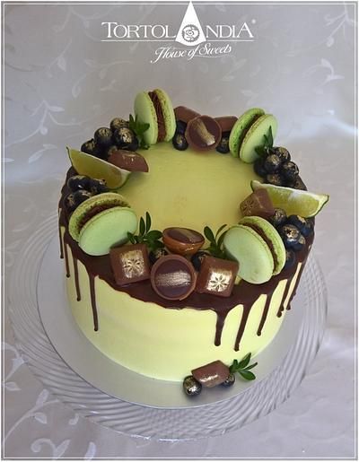 a cake with chocolate and fruit toppings on it