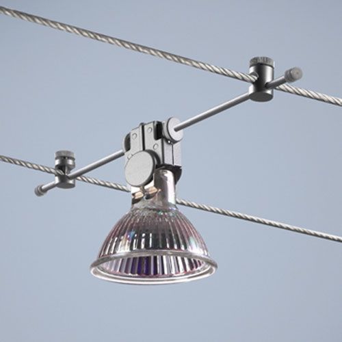 a close up of a light fixture on a power line with wires in the background