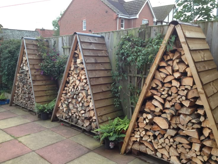 several stacks of firewood stacked on top of each other