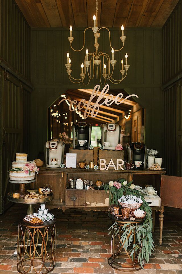 an outdoor bar is decorated with flowers and candles