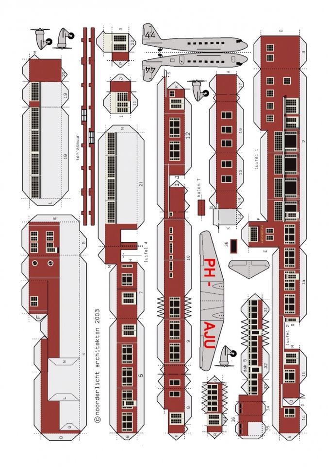 an airplane cut out from paper with the top and bottom section showing all parts in red