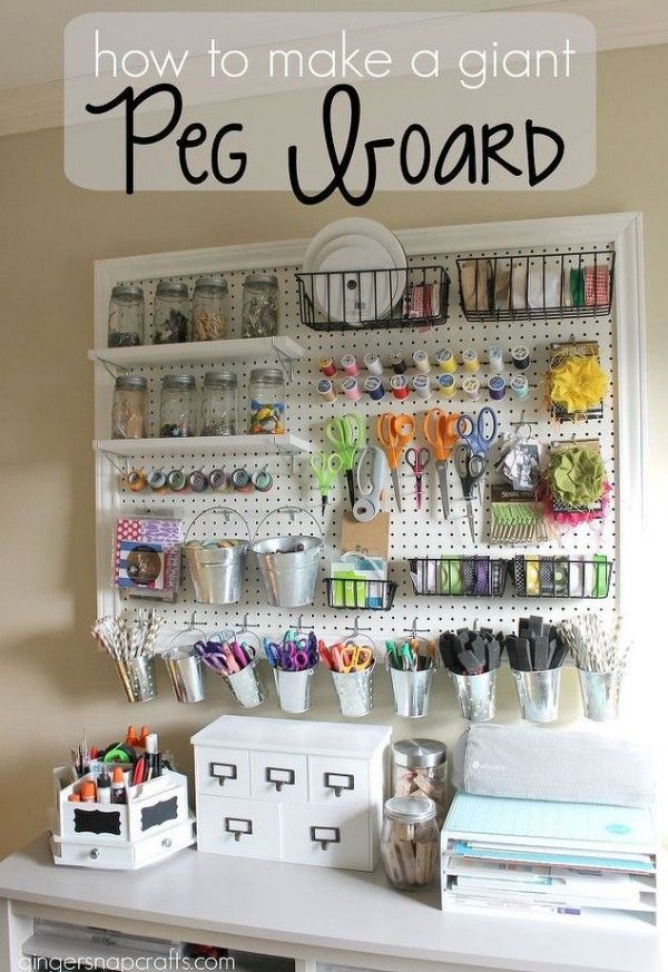 an organized peg board with craft supplies on it