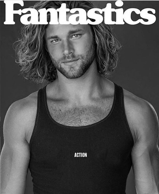 a man with long hair and no shirt on is featured in the cover of an article