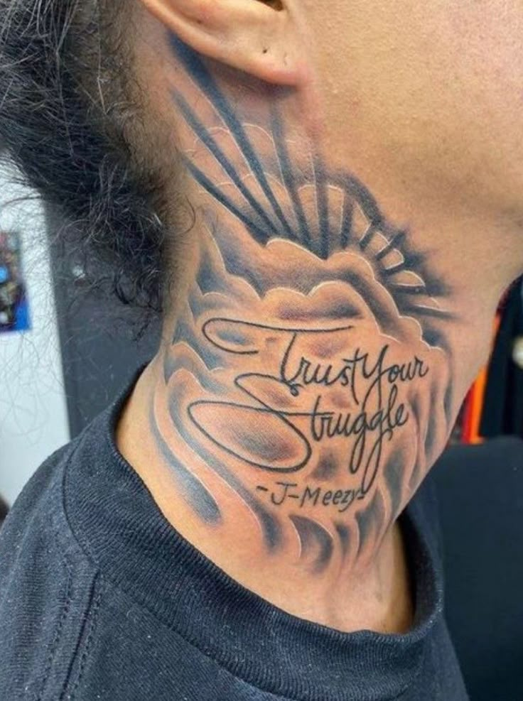 a man with a neck tattoo that says trust your struggle